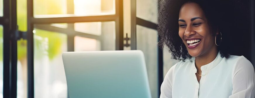 Laughing woman eagerly participates in an online course.