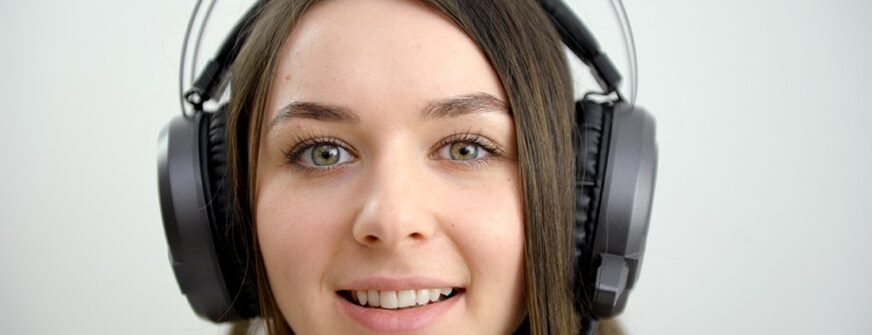 face of a young girl in headphones luminous big headphones professional music sound writer teenager student conference training english language courses listening comprehension